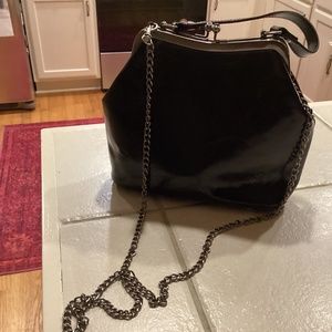 Clip close leather antique style handbag